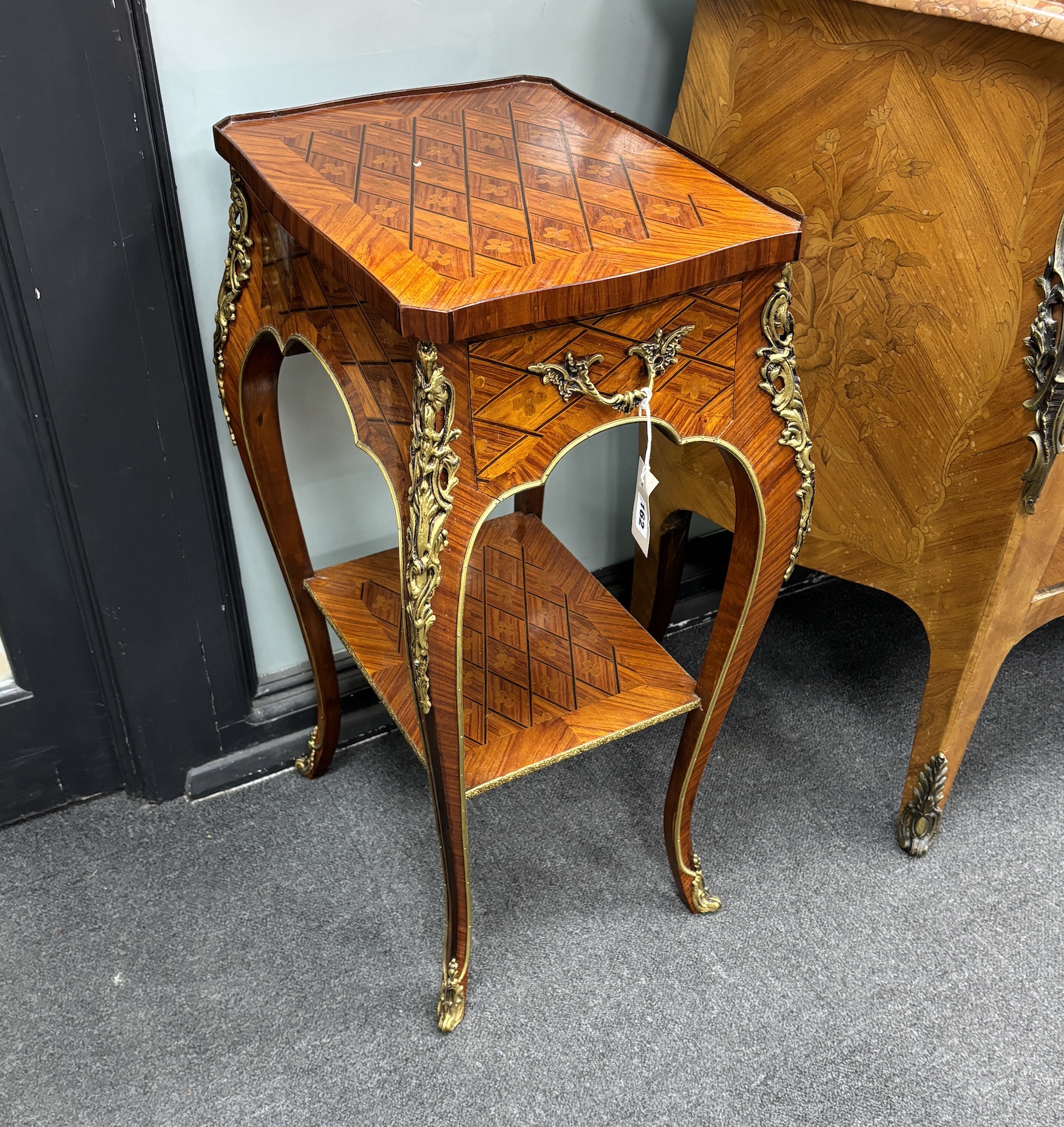 A pair of French transitional style gilt metal mounted kingwood two tier tables, width 32cm, depth 42cm, height 76cm